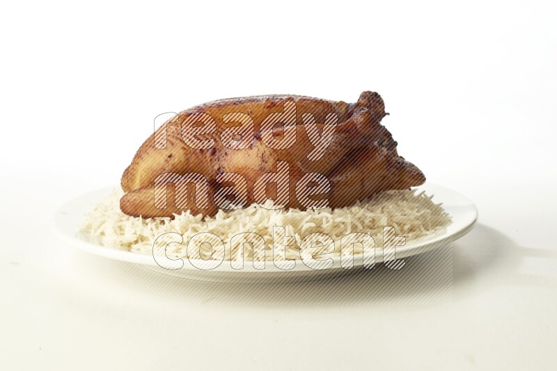 white  basmati Rice with  whole roasted chicken  on a white rounded plate direct on white background