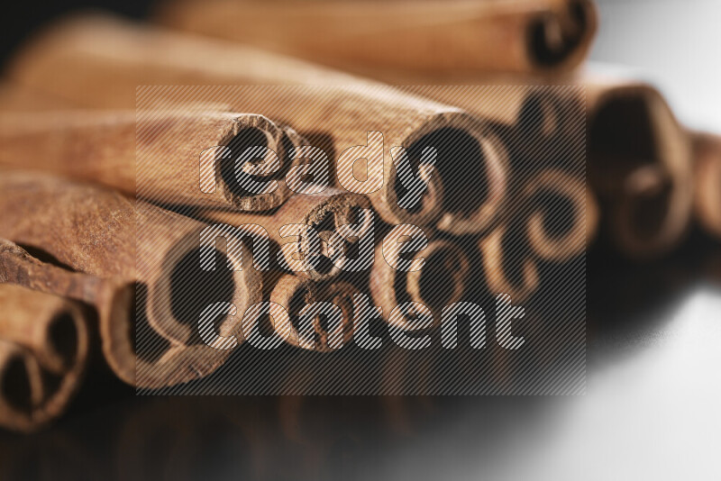 Cinnamon sticks on black background