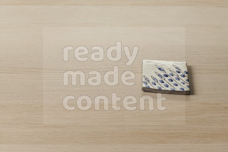 A decorative coaster on light wooden background