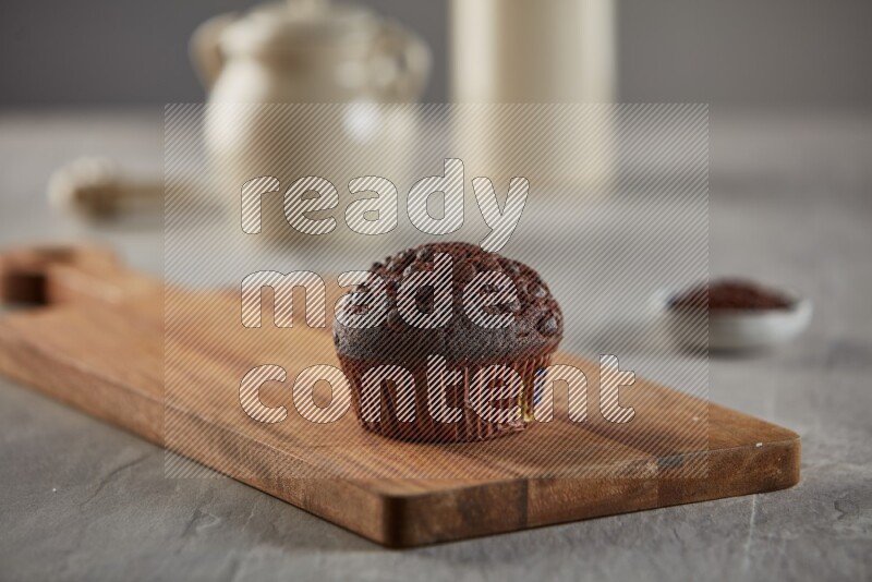 Chocolate cupcake on a wooden board