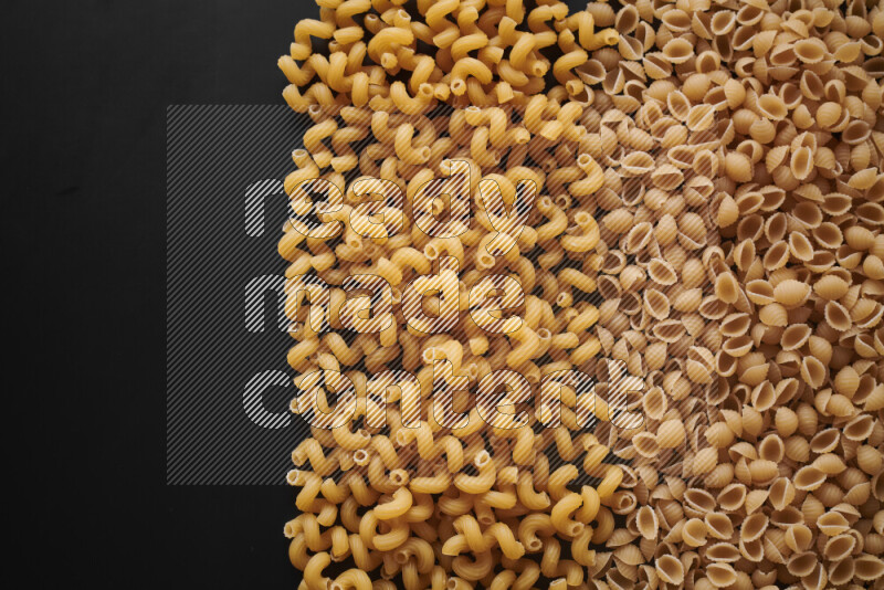 Different pasta types on black background