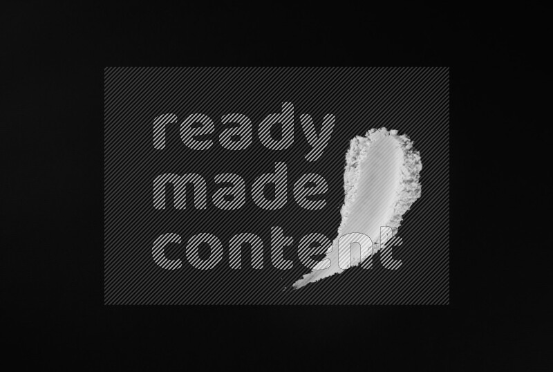 White powder smears on black background