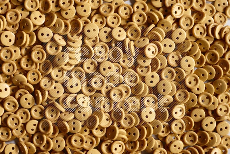Wooden buttons placed on grey background