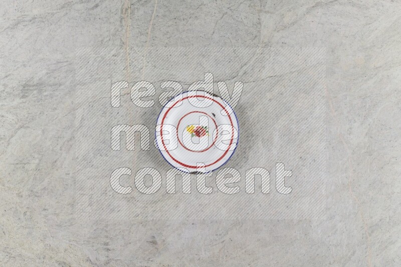 A vintage metal plate on grey marble background