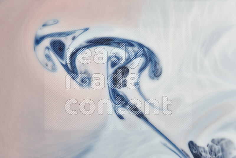 A close-up of abstract swirling patterns in blue, red and white