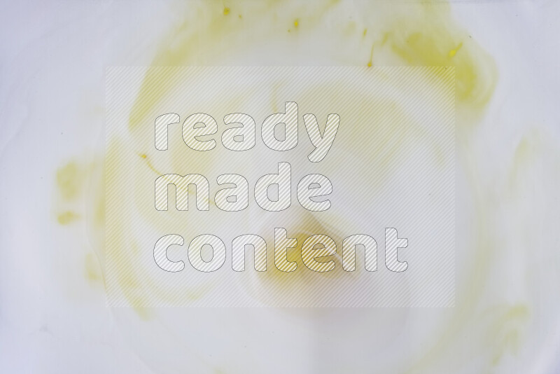 A close-up of abstract swirling patterns in yellow and white