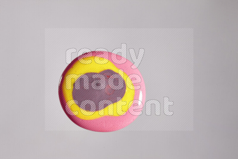 Close-ups of assorted colors blending on a grey background