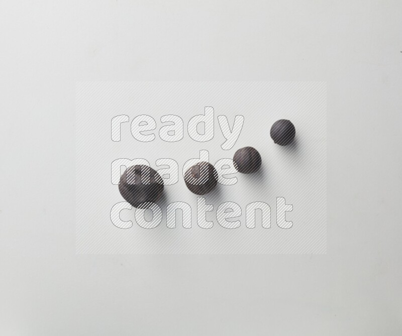 Top-view shot of dried lime (loomi) on white background