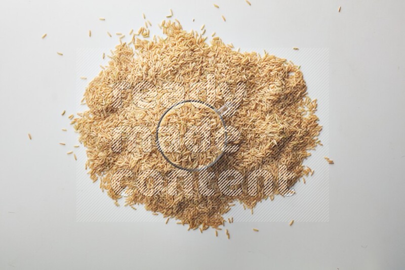 Long grain brown rice on white background