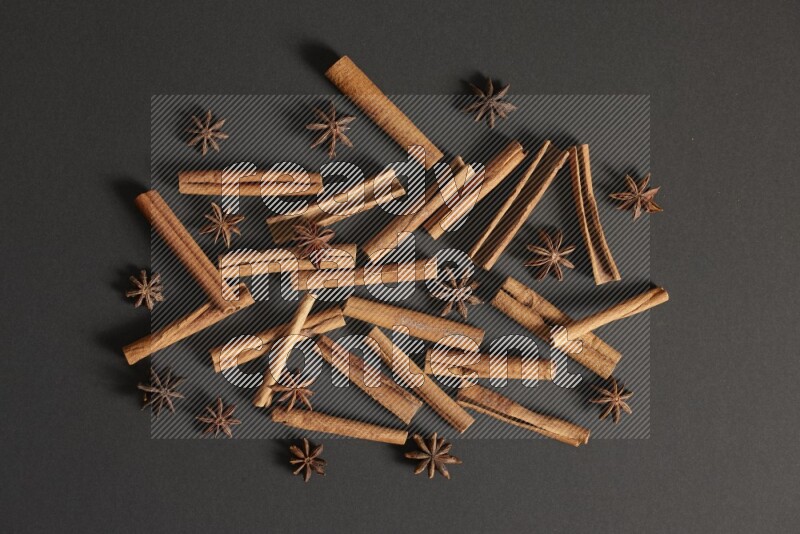 Cinnamon sticks and star anise on black background