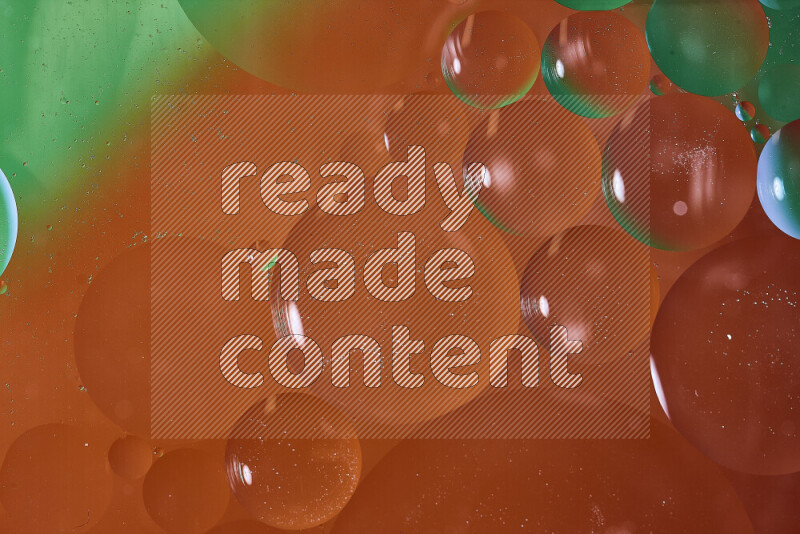 Close-ups of abstract oil bubbles on water surface in shades of green and red