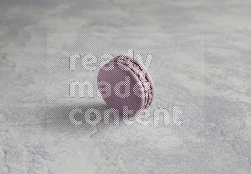 45º Shot of Purple Blueberry macaron on white  marble background