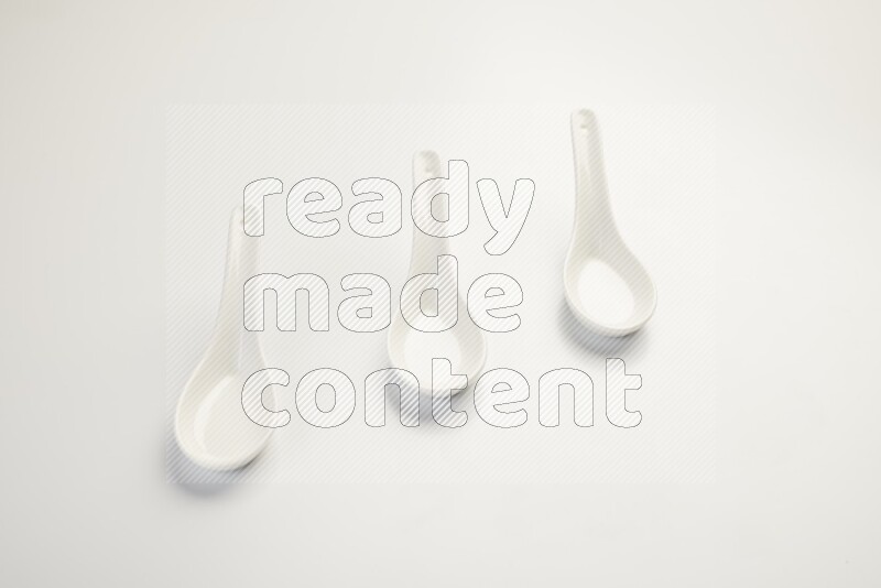 white ceramic soup spoon on white countertop
