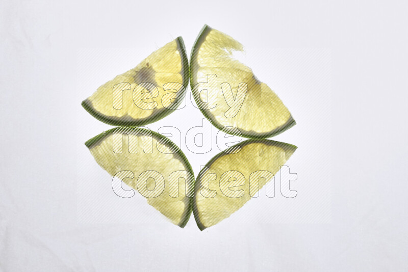 Orange slices on illuminated white background