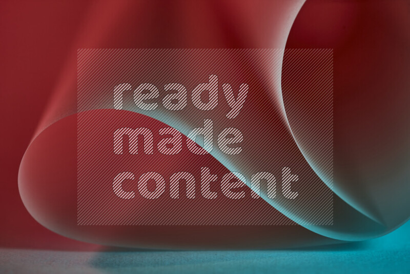 An abstract art piece displaying smooth curves in blue and red gradients created by colored light