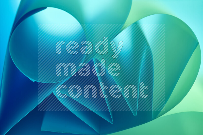 An artistic display of paper folds creating a harmonious blend of geometric shapes, highlighted by soft lighting in green and blue tones