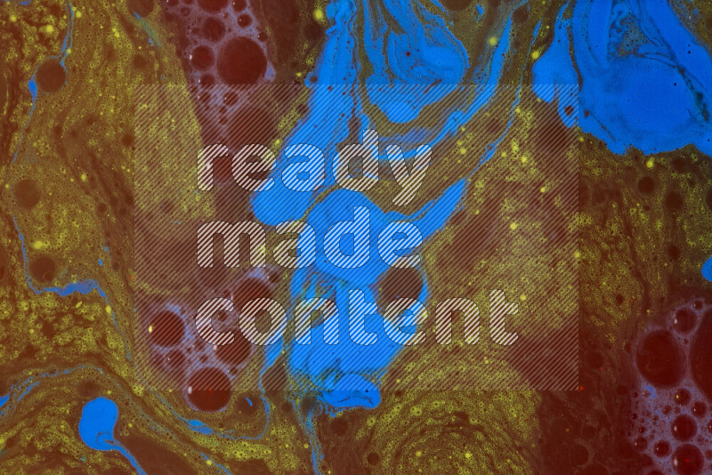 The image depicts a marbling effect with swirling patterns of red, blue and yellow