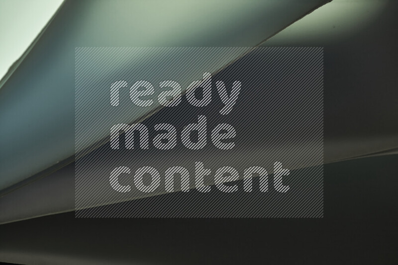 An abstract art piece displaying smooth curves in cold gradients created by colored light