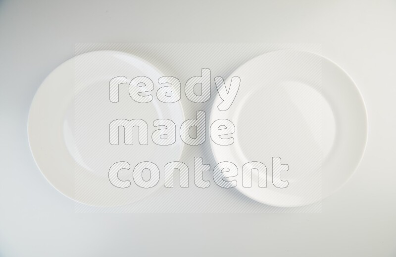 white and black plates on white background