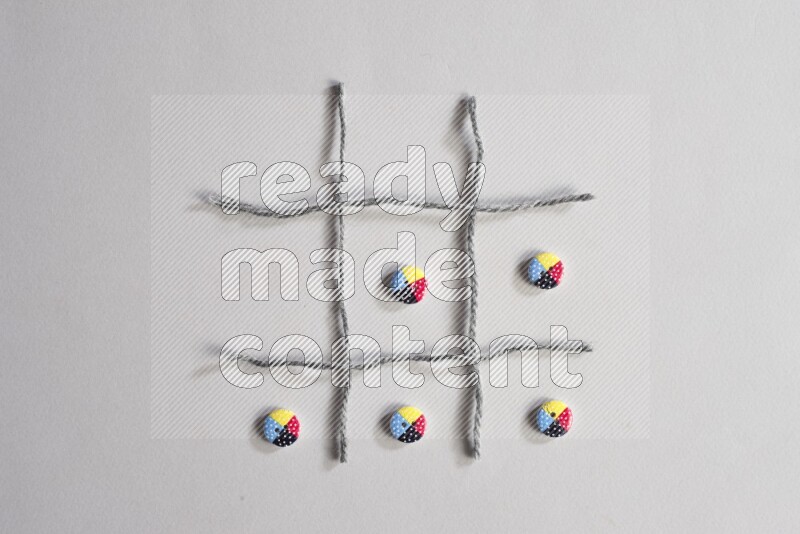 Multicolored buttons placed on grey background