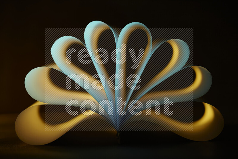 An abstract art piece displaying smooth curves in yellow and green gradients created by colored light