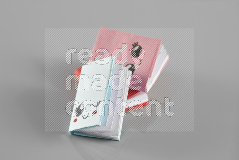 Origami book on grey background