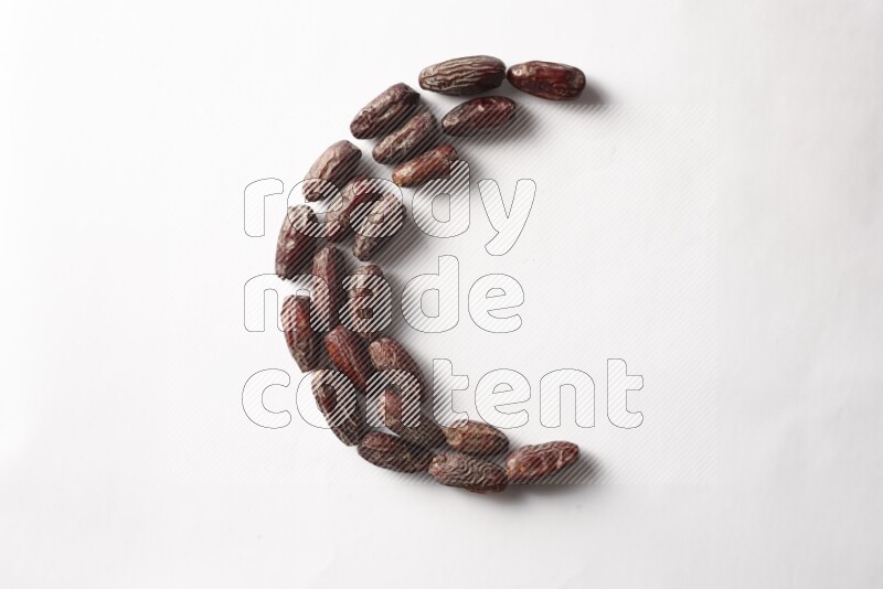 Dates in a crescent shape on white background