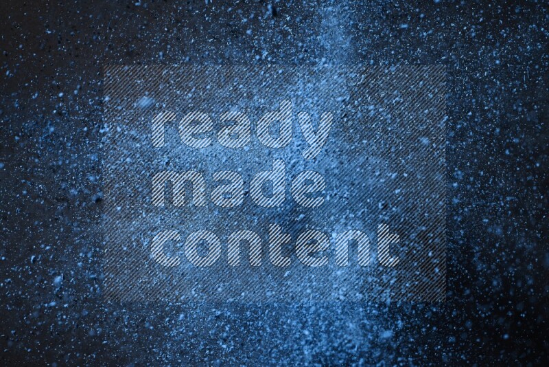 Blue powder explosion on black background