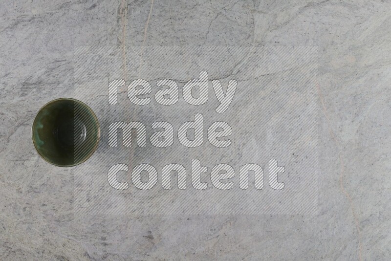A multicolored pottery Bowl on grey marble background