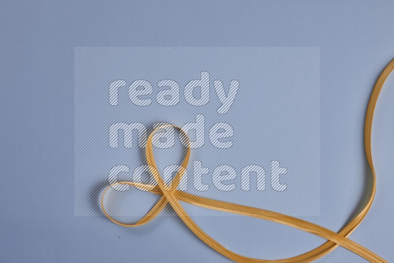 A yellow collection of sewing and tailoring tools arranged on a blue background