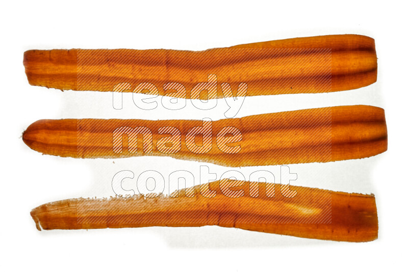 Carrots slices on illuminated white background