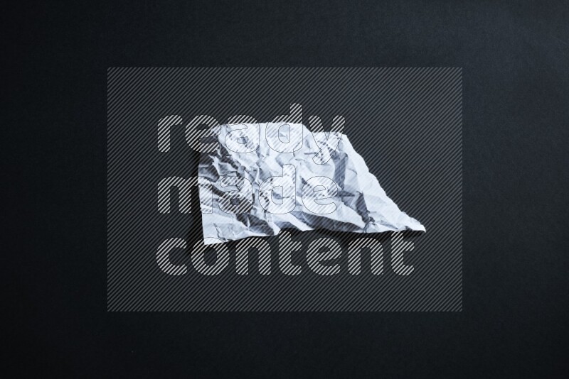 White paper sheet on black background