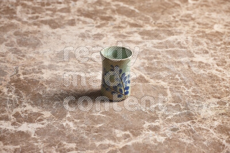 Pottery Cup on Beige Marble Flooring