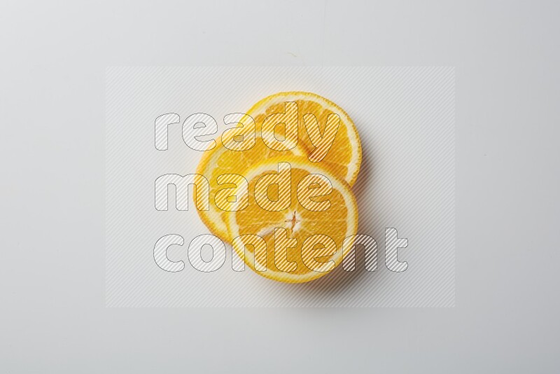 Three orange slices on a white background