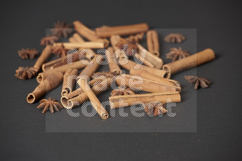 Cinnamon sticks and star anise on black background