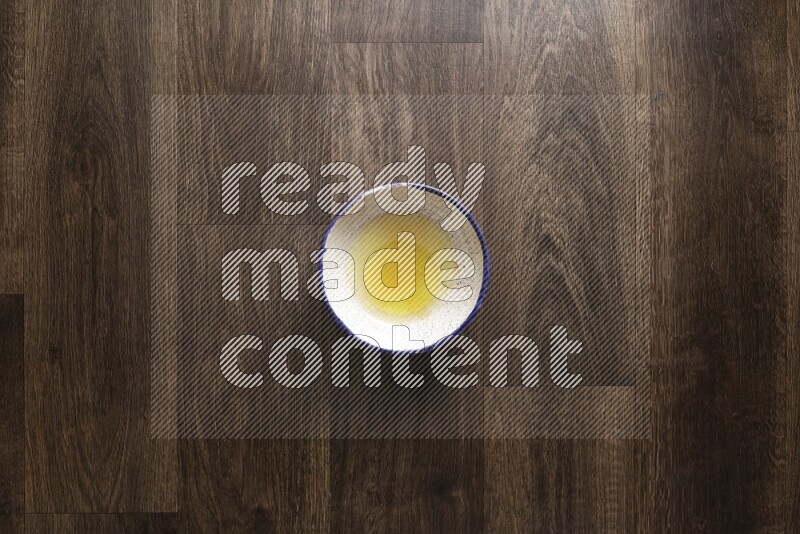 A bowl full of spices and salad dressing ingredients on wooden background