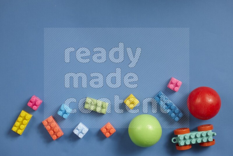 Plastic building blocks with balls on different colored background (kids toys)