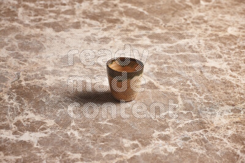 Pottery Cup on Beige Marble Flooring