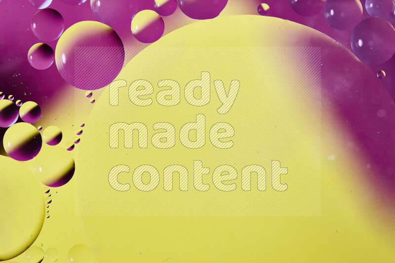 Close-ups of abstract oil bubbles on water surface in shades of yellow and pink