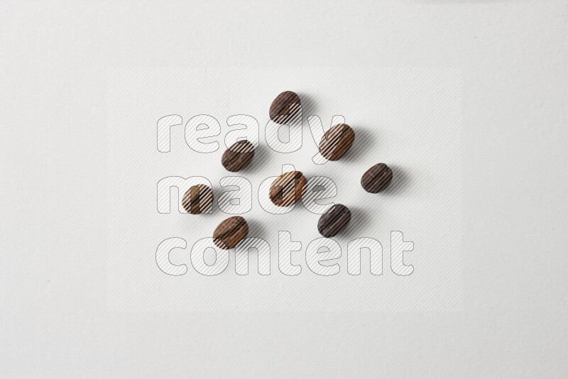 Roasted coffee beans on white background