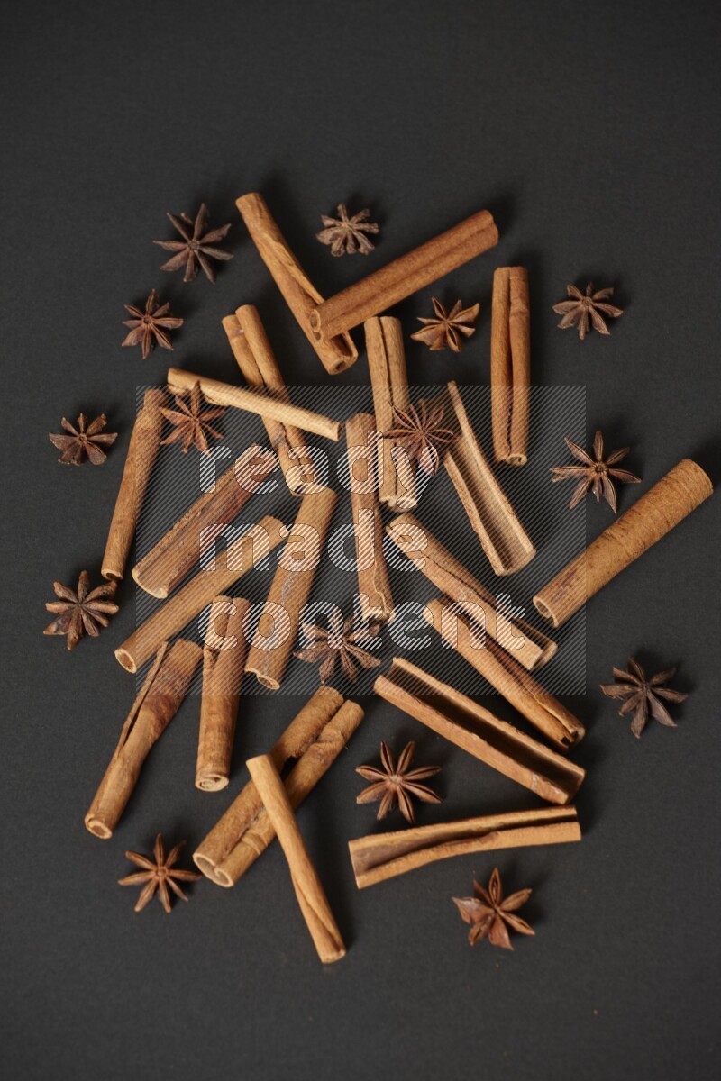 Cinnamon sticks and star anise on black background