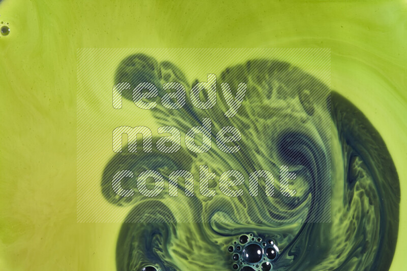 A close-up of abstract swirling patterns in green gradients