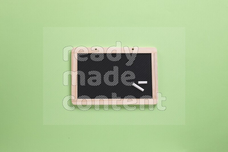 A blackboard on green background