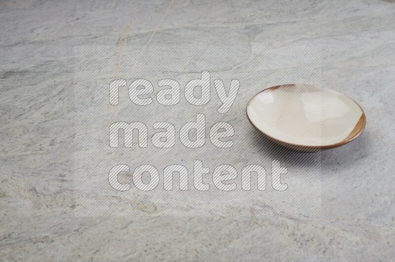 Multicolored Pottery Plate On Grey Marble Flooring