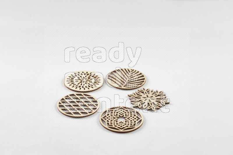Crafted wooden coasters on white background
