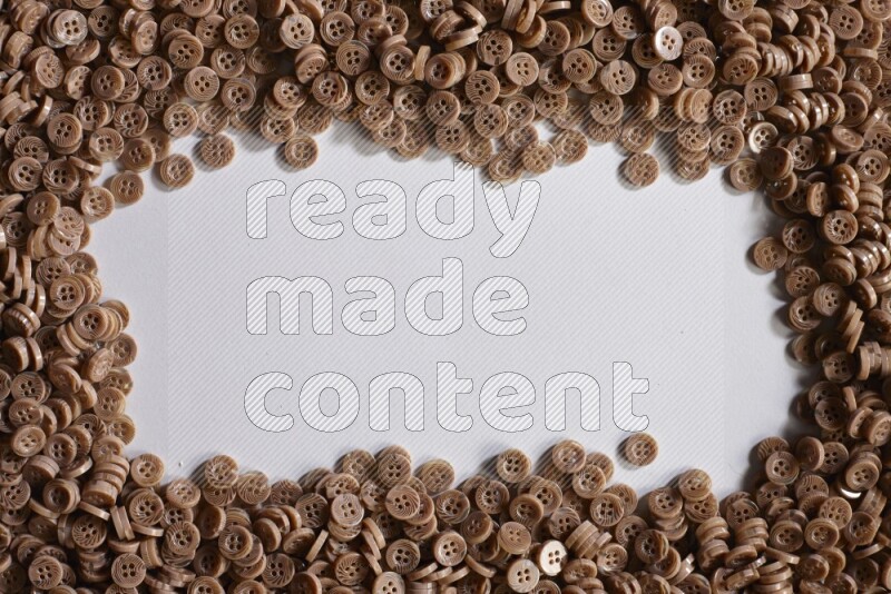 Brown buttons placed on grey background