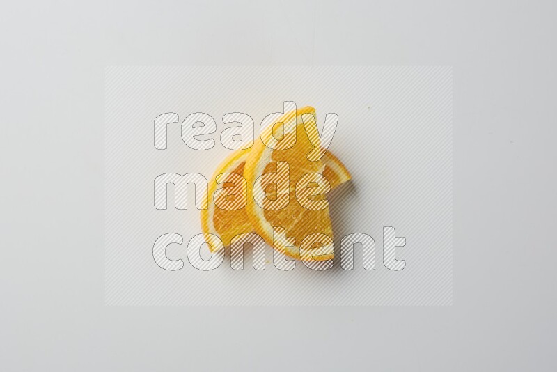 Two halves of an orange slices on white background