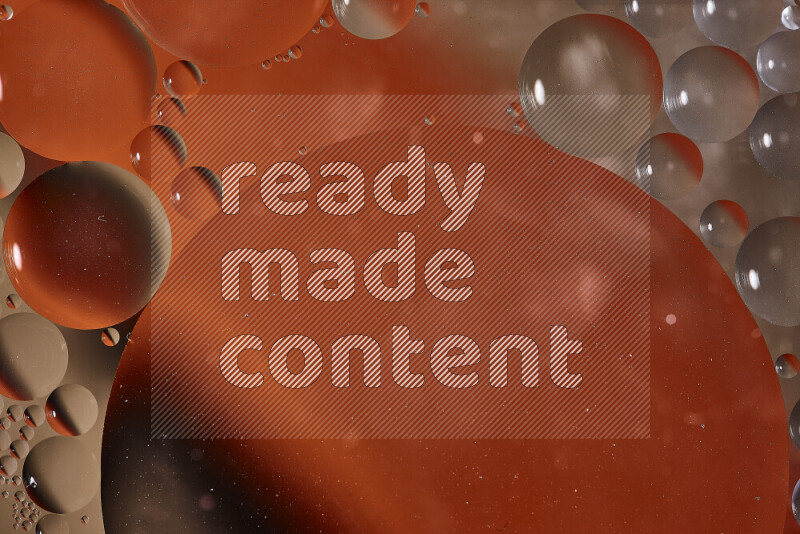 Close-ups of abstract oil bubbles on water surface in shades of orange and brown