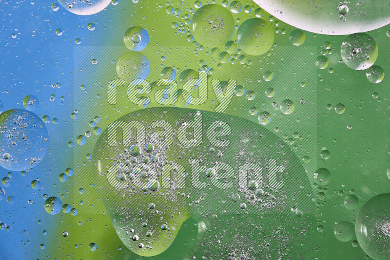 Close-ups of abstract oil bubbles on water surface in shades of green and blue