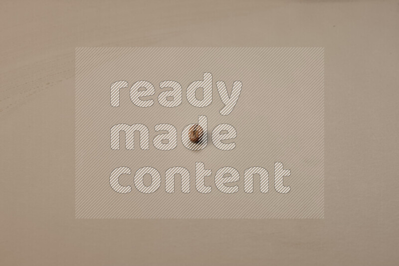 Roasted coffee beans on beige background